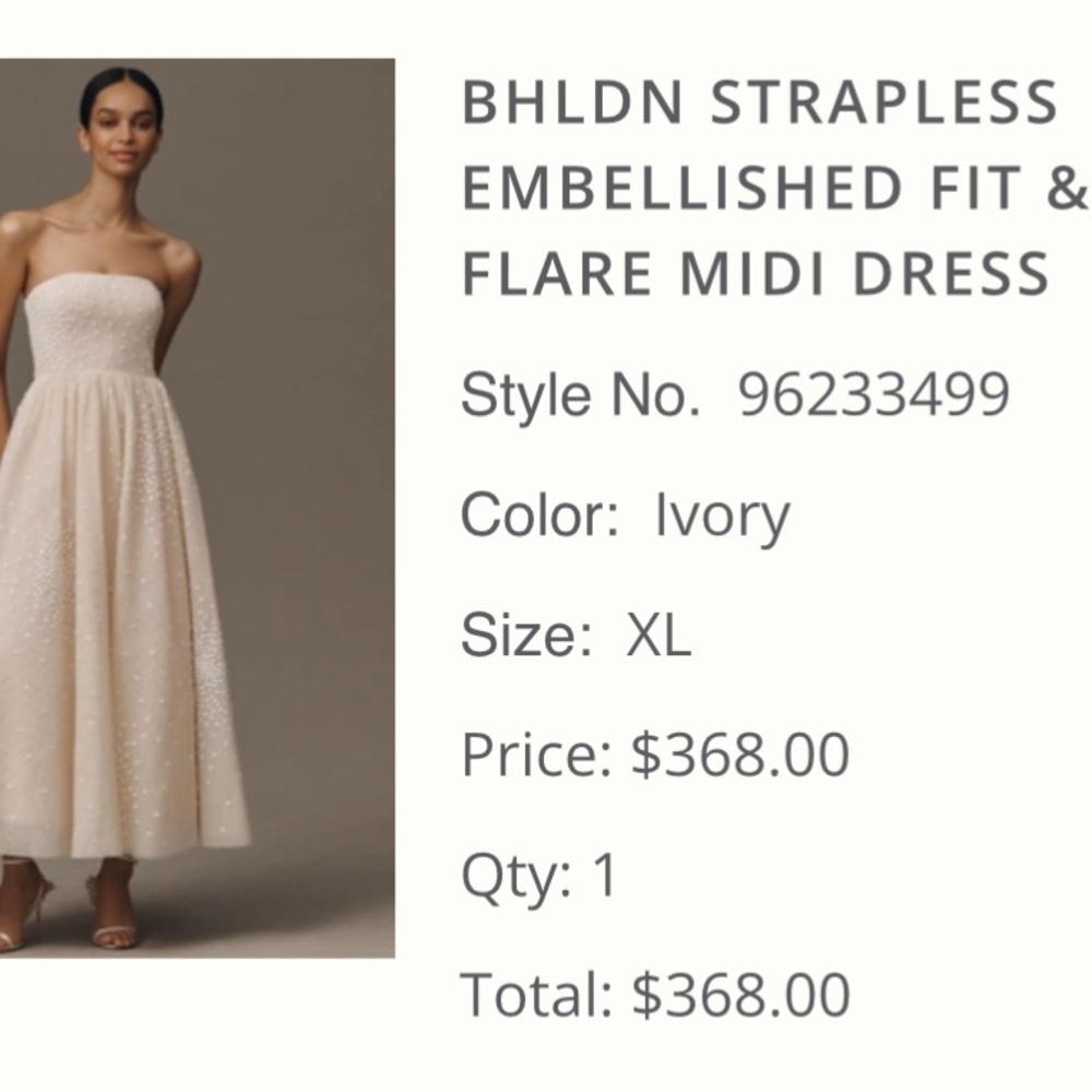 Ivory strapless BHLDN dress with flower embellishment.